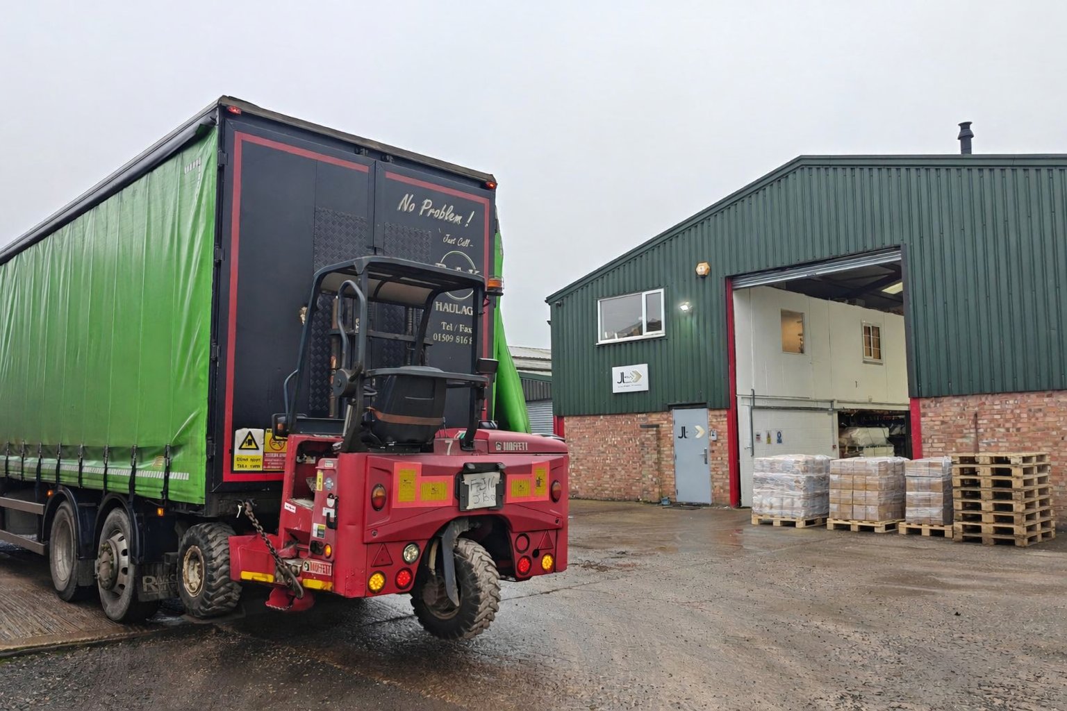 JL Logistics depot yard with HGV and Moffett loading